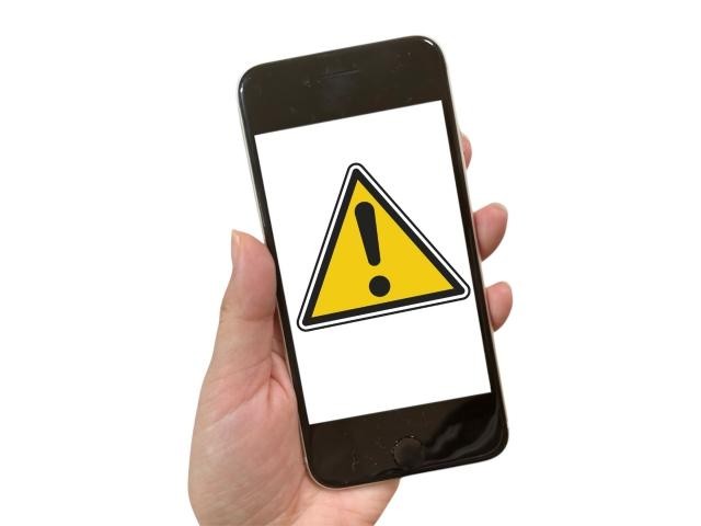 スマホに表示された注意マーク